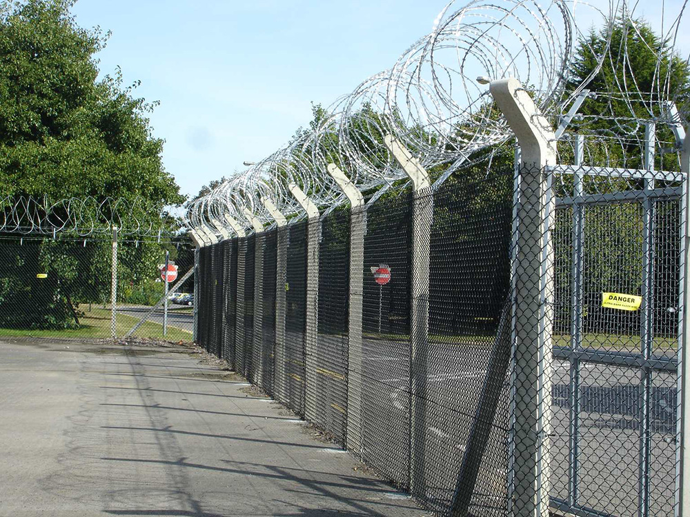 chainlink fencing with barbed wire on top