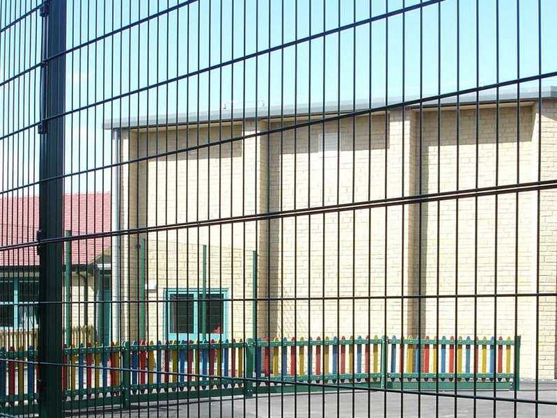 Mesh fencing to a commercial building