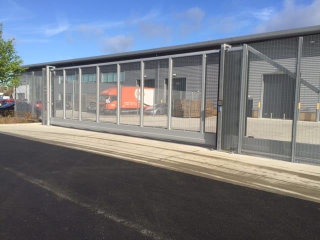 Rigid mesh fencing panels along a commercial boundary