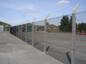 Chainlink fencing with barbed wire on commercial site