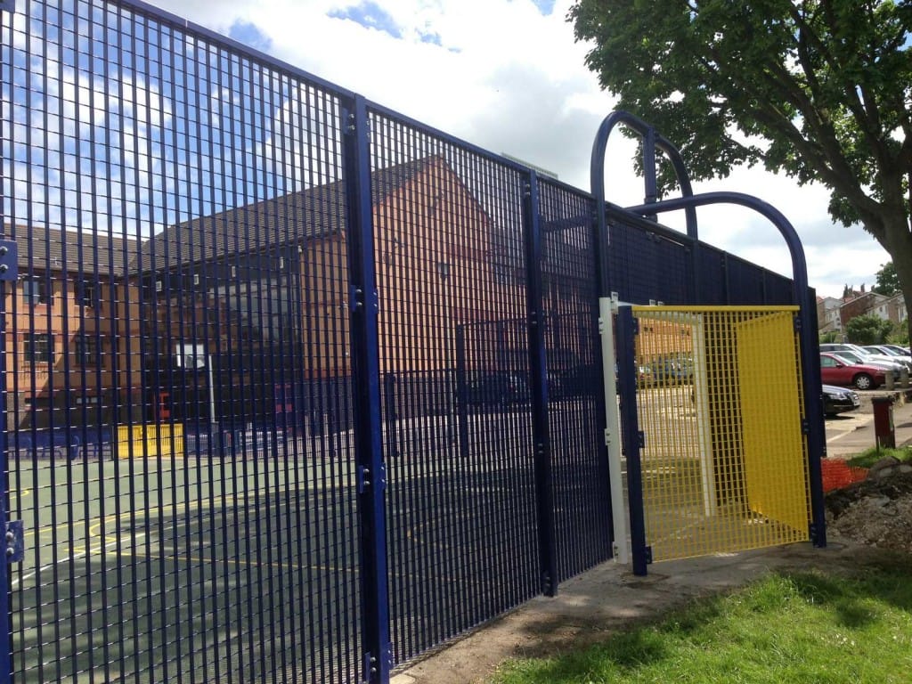 Rigid mesh fencing surrounding school ball sports court